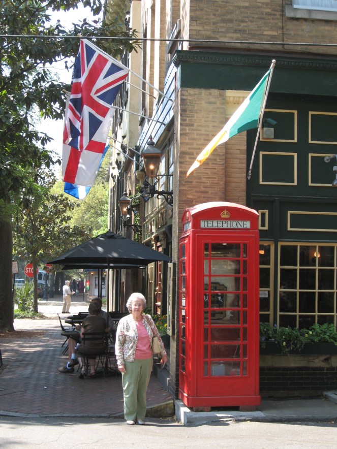 Mom outside the Six Pence Pub's telephone booth